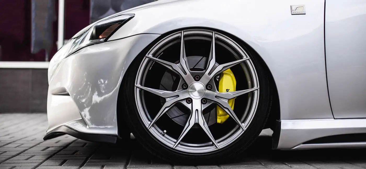 Freshly cleaned alloy wheel with yellow brake caliper